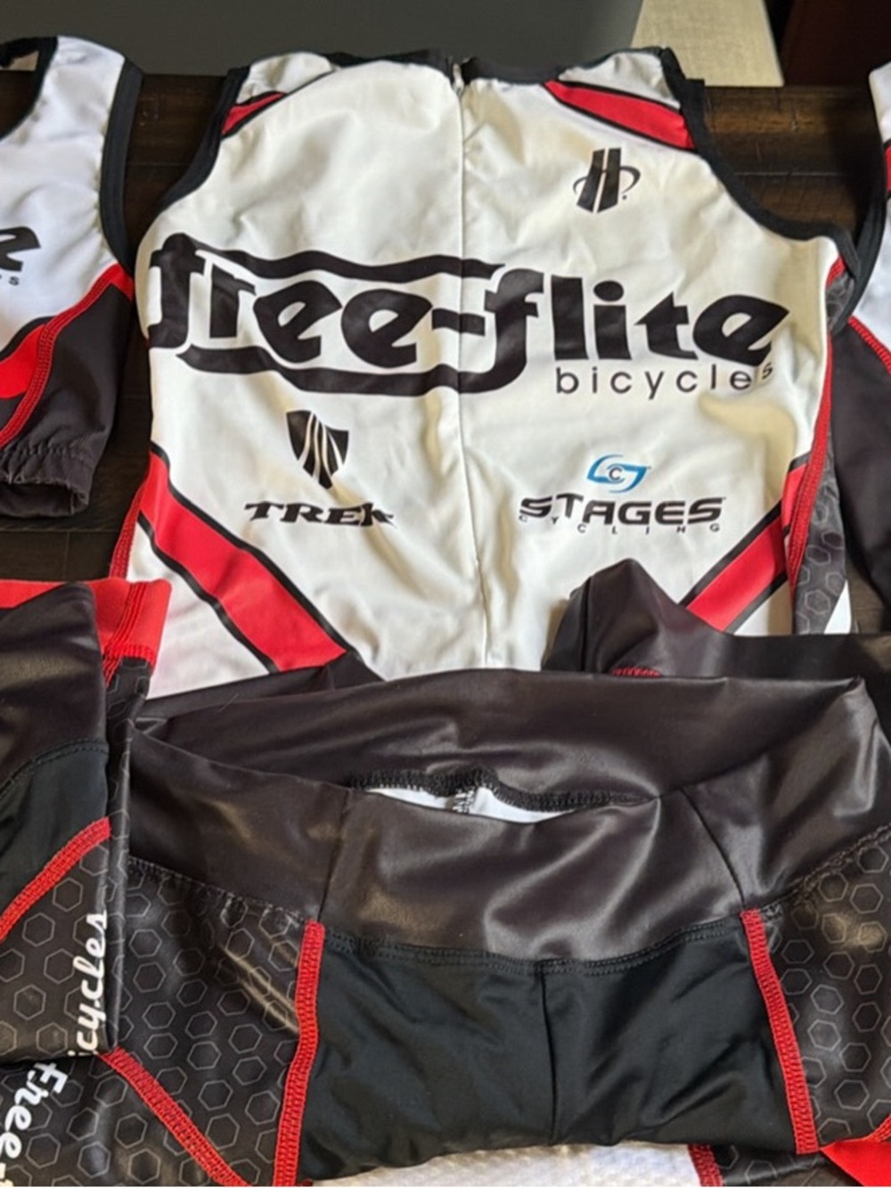 1 sports bra, 2 tops, 3 bike/tri shirts. Mixture of women’s small and x-small